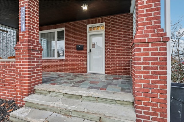 property entrance with covered porch