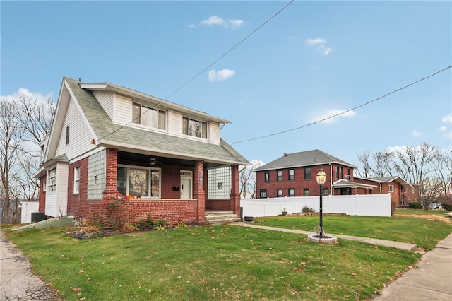 view of front of property with a porch and a front yard