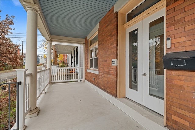 view of patio with covered porch and french doors