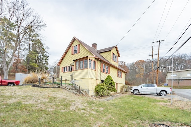 view of property exterior featuring a lawn