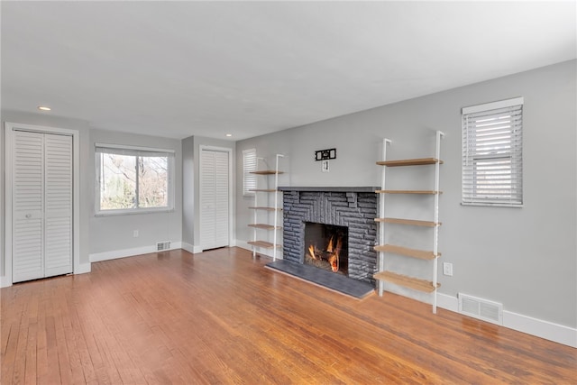 unfurnished living room with hardwood / wood-style flooring