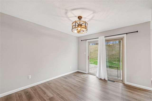 unfurnished room featuring light wood-type flooring