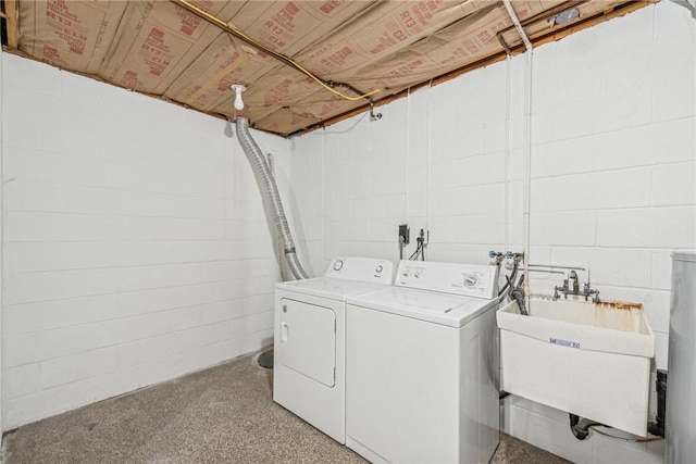 laundry area featuring separate washer and dryer and sink