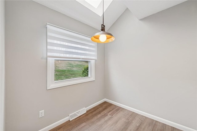 unfurnished room with wood-type flooring