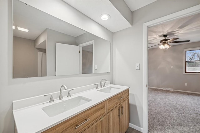 bathroom featuring ceiling fan and vanity