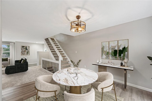 dining area with hardwood / wood-style floors