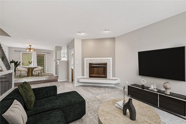 carpeted living room with a fireplace and french doors