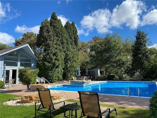 view of swimming pool featuring a patio