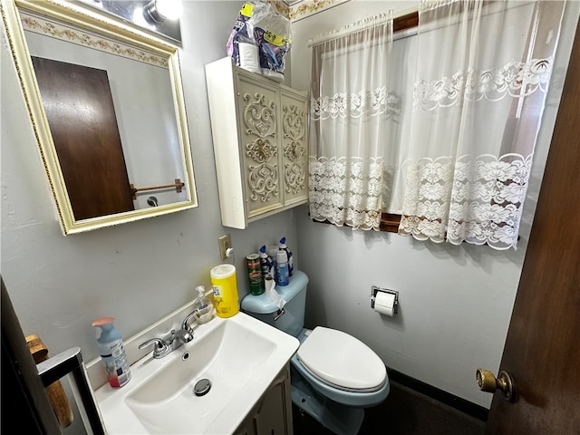 bathroom with vanity and toilet