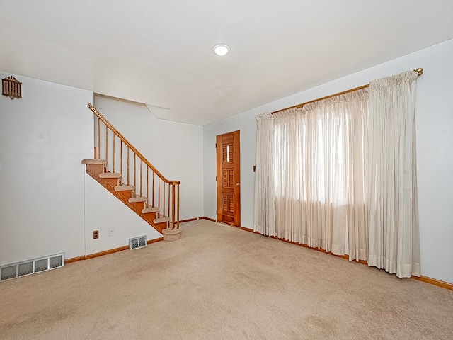 unfurnished living room with carpet flooring