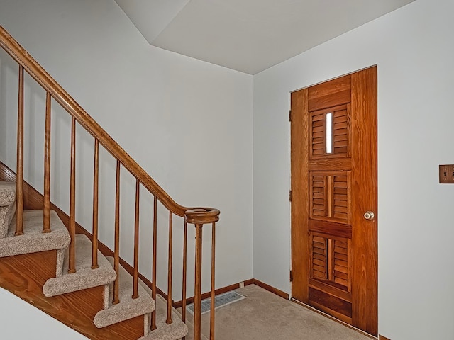 view of carpeted foyer