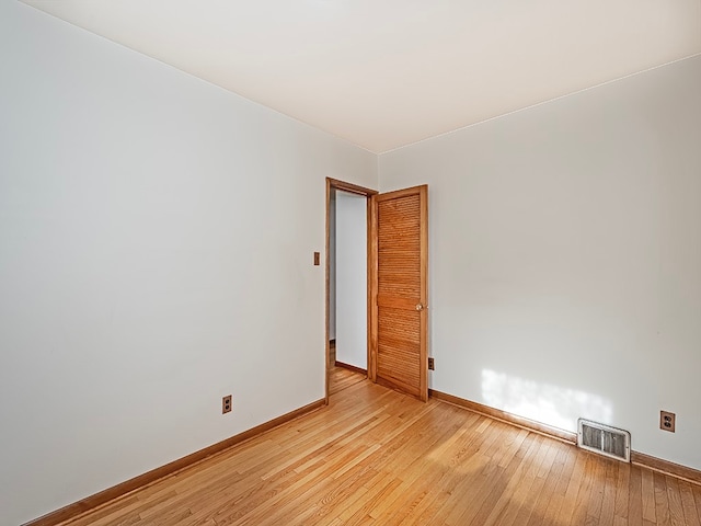 unfurnished room with light hardwood / wood-style floors