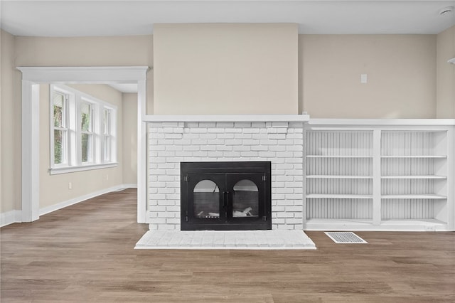 room details featuring hardwood / wood-style floors and a fireplace