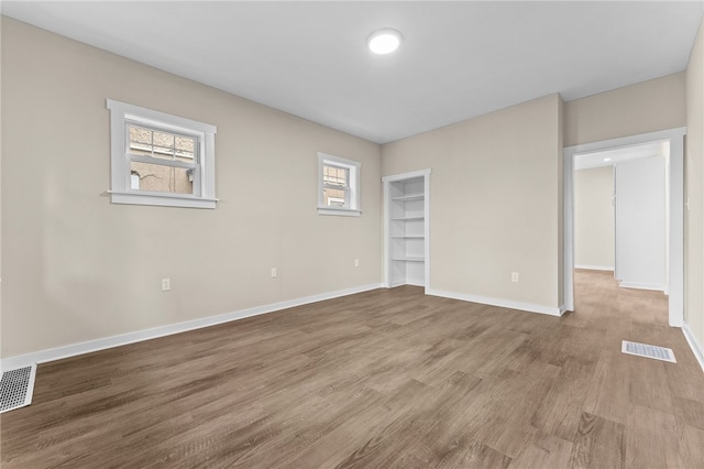 empty room with light hardwood / wood-style floors