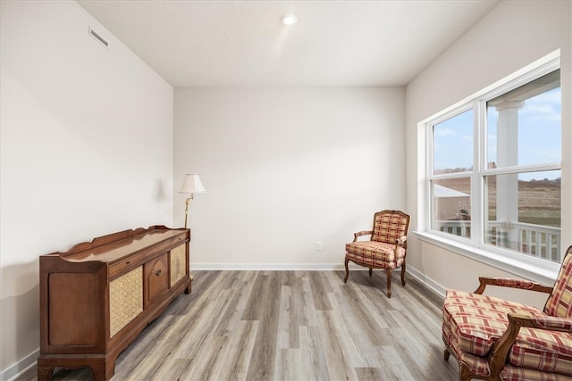 sitting room featuring light hardwood / wood-style flooring