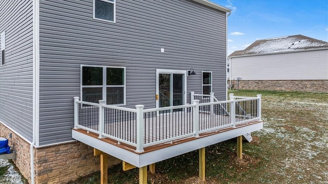 rear view of house with a wooden deck