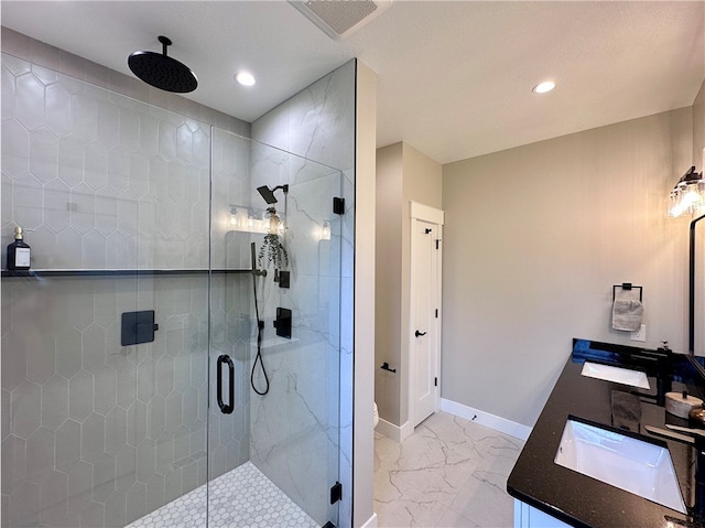 bathroom with vanity and an enclosed shower