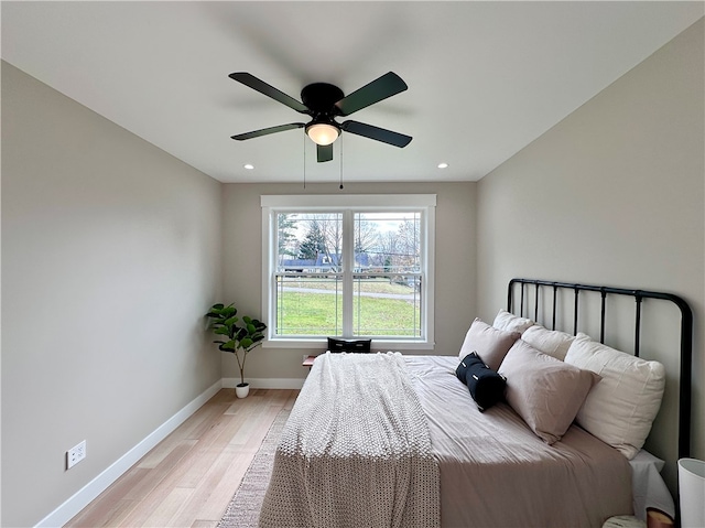 bedroom featuring ceiling fan and light wood-type flooring