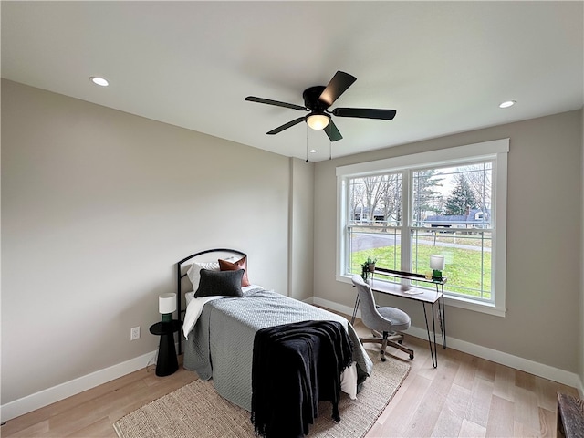 bedroom featuring ceiling fan and light wood-type flooring