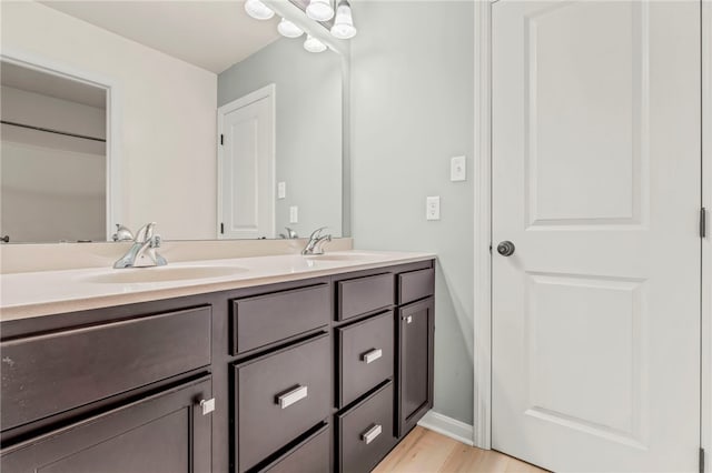 bathroom with vanity and hardwood / wood-style flooring