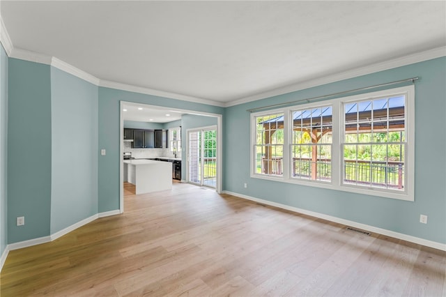 unfurnished living room with light hardwood / wood-style flooring and ornamental molding