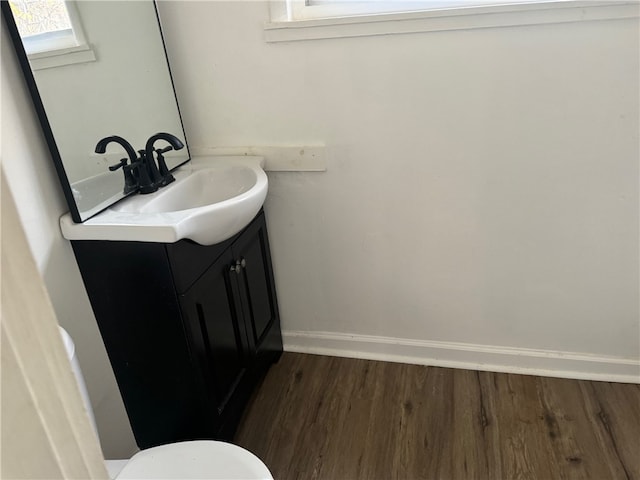 bathroom featuring hardwood / wood-style flooring and vanity