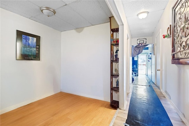 corridor featuring hardwood / wood-style floors