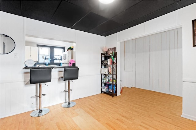 interior space with white fridge and wood-type flooring