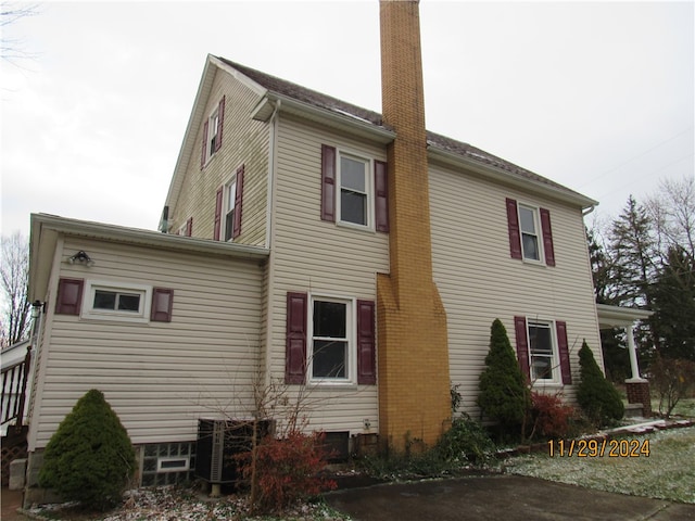 view of side of property featuring central AC unit