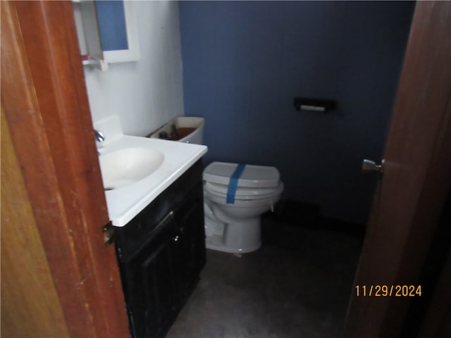 bathroom with vanity and toilet