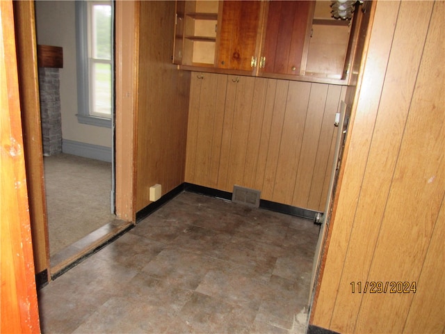 interior space featuring wooden walls