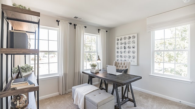 view of carpeted dining area