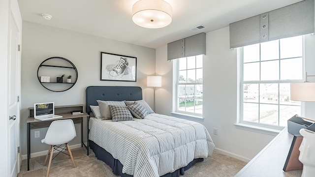 bedroom with light carpet