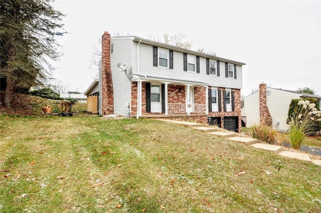 view of front of home with a front lawn and a porch