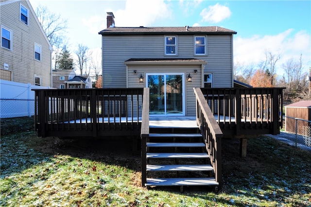 rear view of property featuring a deck