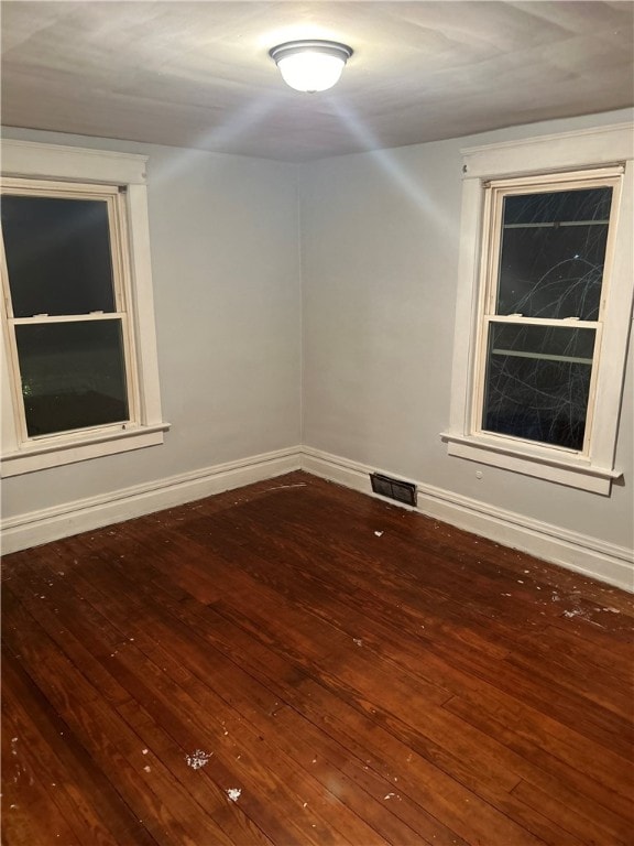 empty room featuring hardwood / wood-style floors