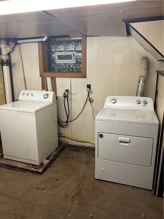 clothes washing area with independent washer and dryer