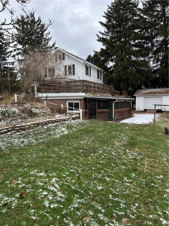 view of front facade with an outbuilding and a front lawn