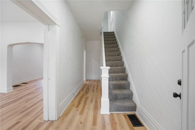 staircase featuring hardwood / wood-style flooring