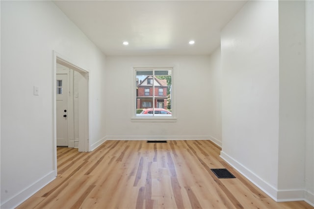 spare room with light hardwood / wood-style flooring