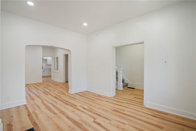 spare room with light hardwood / wood-style floors