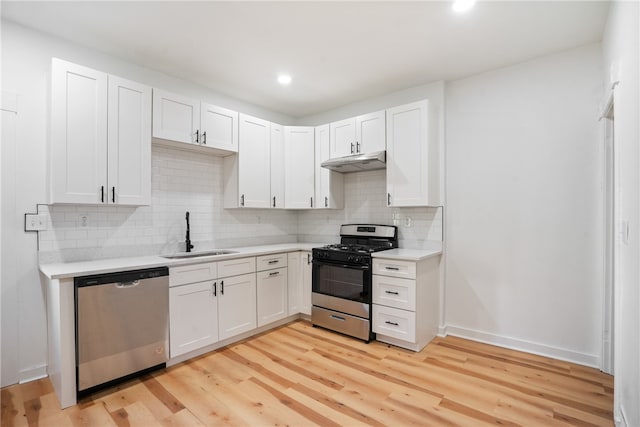 kitchen featuring light hardwood / wood-style floors, white cabinetry, sink, and appliances with stainless steel finishes