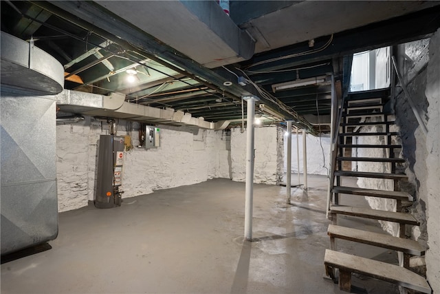 basement featuring electric panel, gas water heater, and heating unit