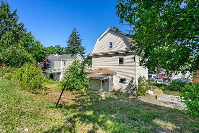 rear view of property featuring a patio