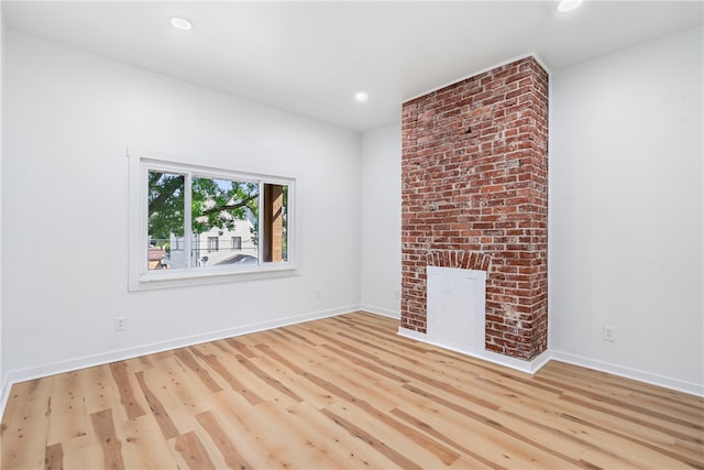 unfurnished living room featuring light hardwood / wood-style floors