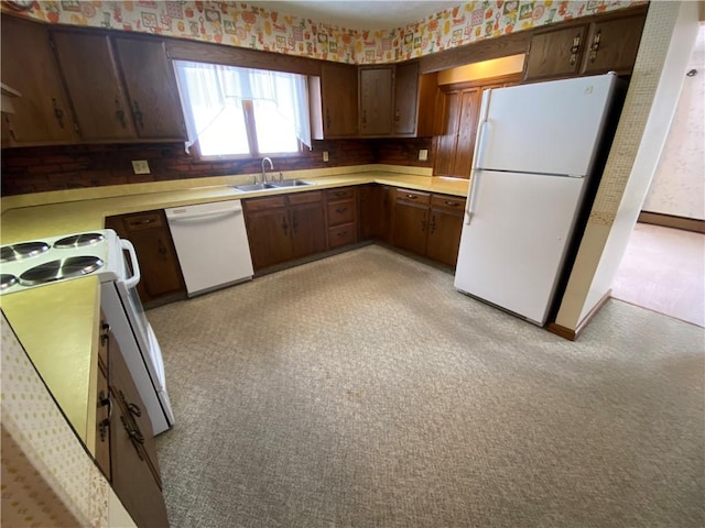 3240 E Lake Rd, Shenango, PA 16134 - kitchen with white appliances, light countertops, wallpapered walls, and light carpet