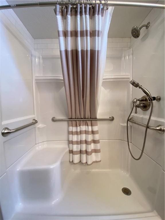 bathroom featuring walk in shower