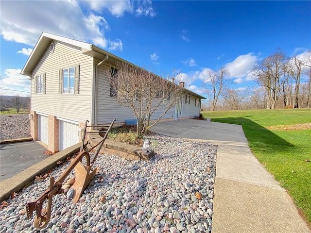 3240 E Lake Rd, Shenango, PA 16134 - view of home's exterior featuring an attached garage, a yard, and driveway