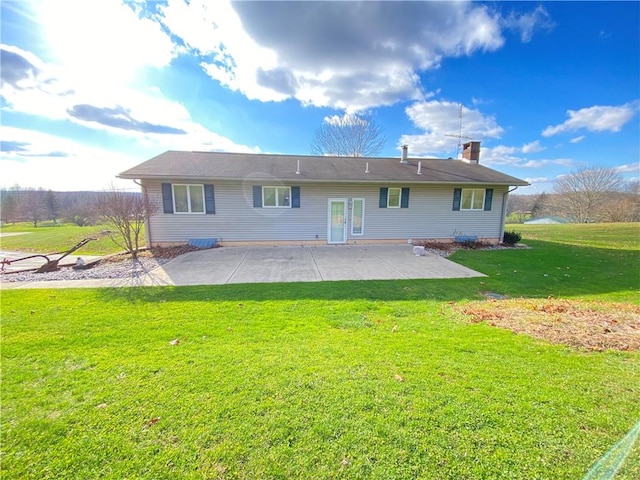3240 E Lake Rd, Shenango, PA 16134 - rear view of house featuring a patio area, a yard, and a chimney