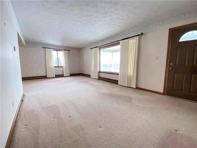 3240 E Lake Rd, Shenango, PA 16134 - carpeted empty room with a textured ceiling